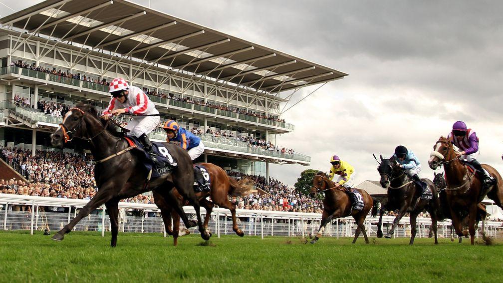 YORK, ENGLAND - AUGUST 20:  Sole Power ridden by Wayne Lorden wins the Coolmore Nunthorpe Stakes during the Yorkshire Ebor Festival at York Race Track on August 20, 2010 in York, England.  (Photo by Ross Kinnaird/Getty Images)