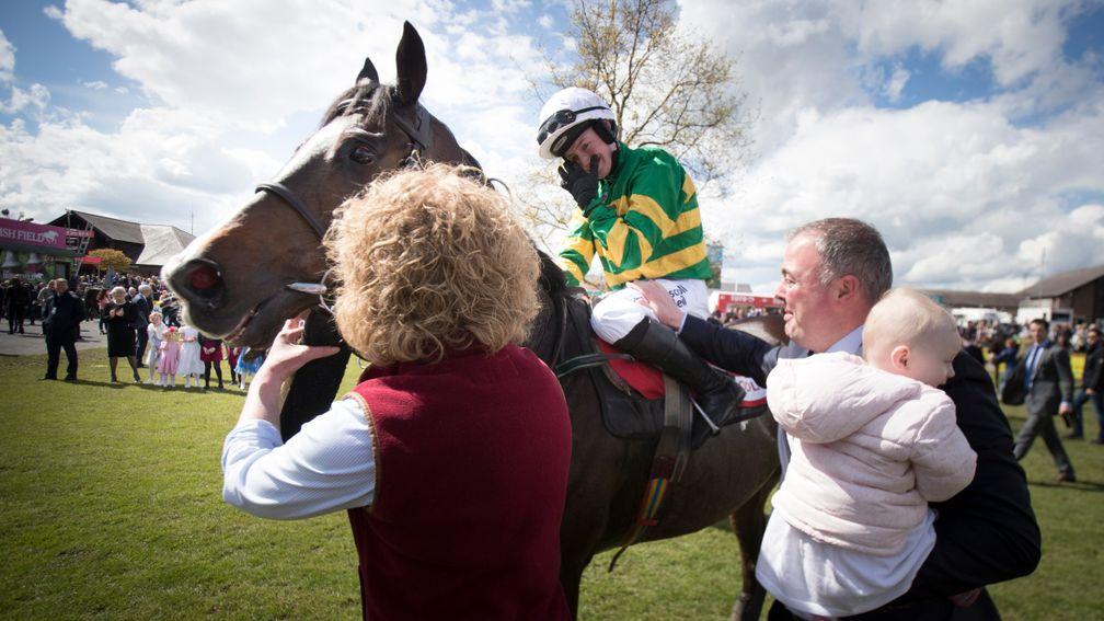 An emotional Nina Carberry with her husband Ted and daughter Rosie after riding her final winner aboard Josies Orders in the cross-country chase at Punchestown on Saturday