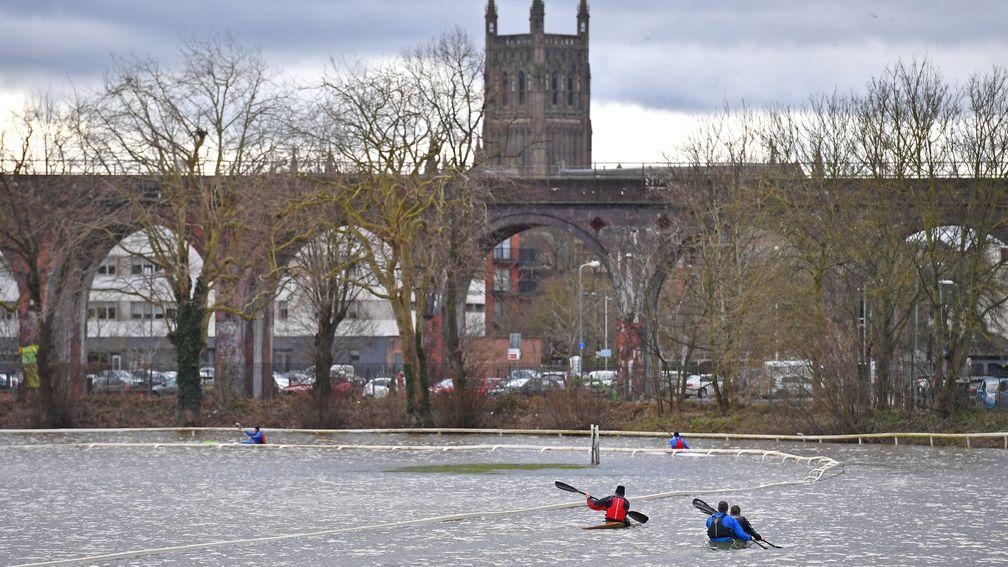 Members of the local Canoe Club kayaking at a flooded Worcester