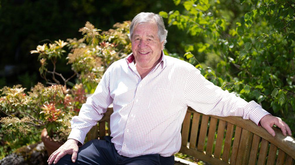 Sir Michael Stoute sits in the garden at his home, Harlech House, in Newmarket 