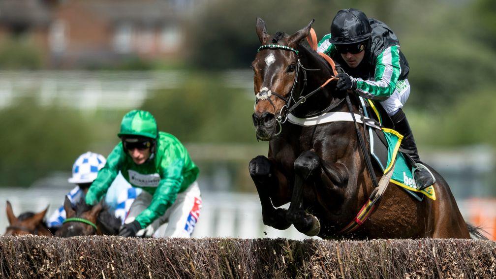 Up up and away: Altior and Nico de Boinville clear the last in the bet365 Celebration Chase at Sandown on Saturday