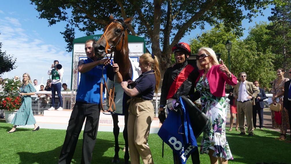 Sean Levey and owner Elizabeth 'Bunny Roberts' pose with Aristia after winning the Group 1 Darley Prix Jean Romanet at Deauville