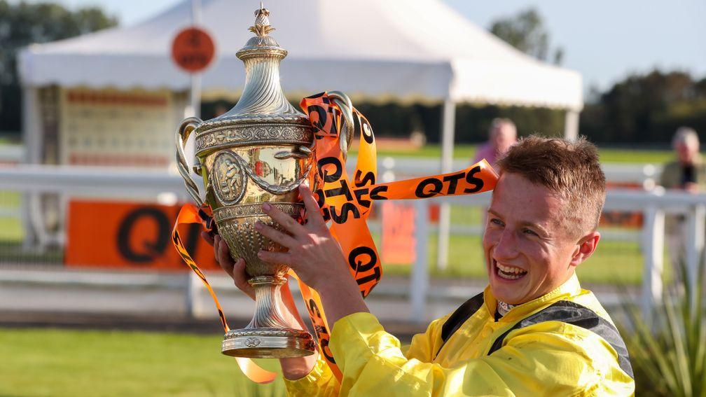 Up for the Cup: Tom Marquand lifts the big-race trophy at Ayr