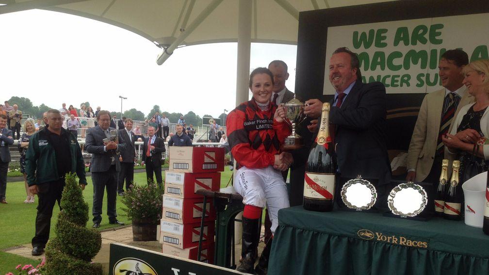 Emily Easterby smiles on the scales at York after winning her weight in champagne