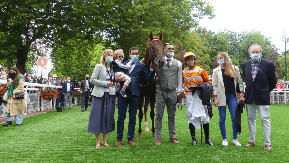 Team Marianafoot: trainer Jerome Reynier (navy suit) with Mickael Barzalona and owner Jean-Claude Seroul (far right)