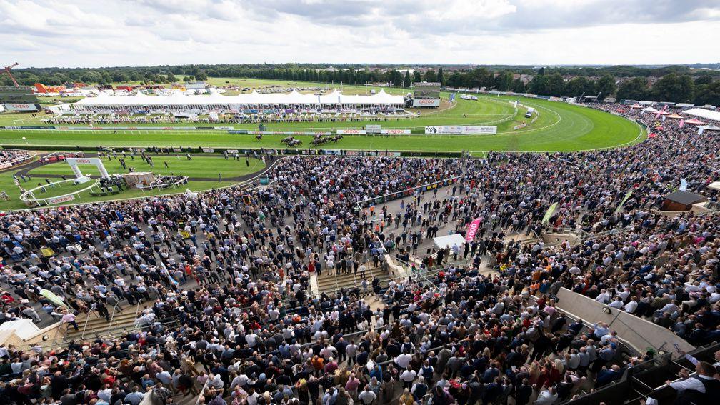Racegoers at a packed Doncaster watch Hurricane Ivor land the Portland on Saturday