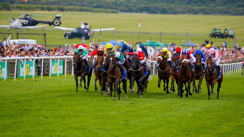 Limato (white cap) winning the 2016 July Cup