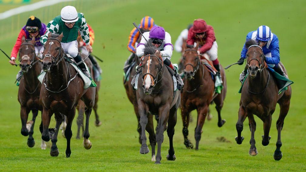 Supremacy (white and purple) wins the Juddmonte Middle Park at Newmarket for Adam Kirby and Clive Cox