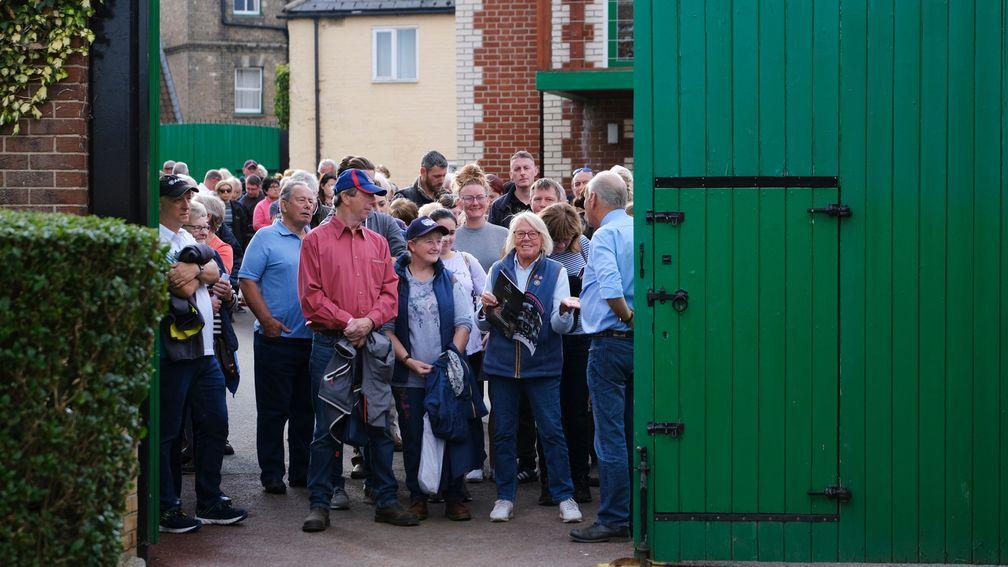 Visitors gather at Sir Mark Prescott's stables