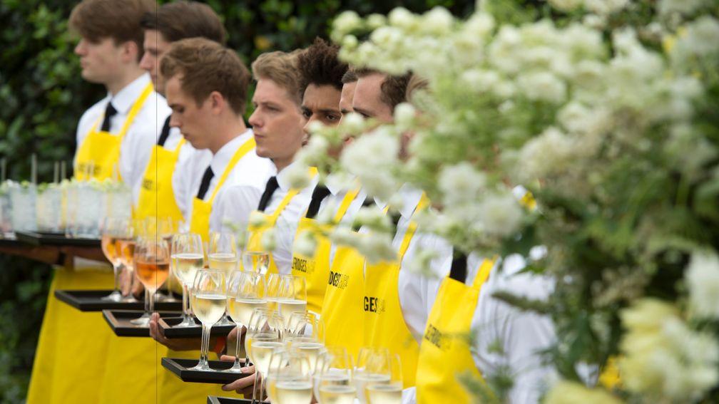 Waiters greet guests at the drinks reception ahead of the Goffs London Sale at The Orangery at Kensington Palace
