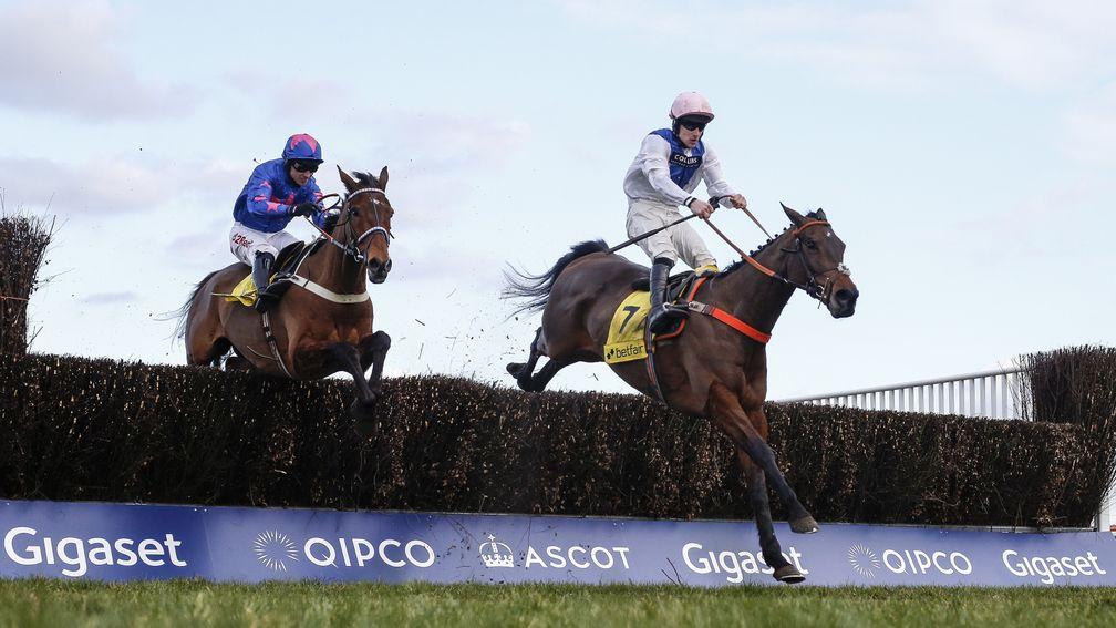 Waiting Patiently and Brian Hughes lead Cue Card and Paddy Brennan over the last at Ascot