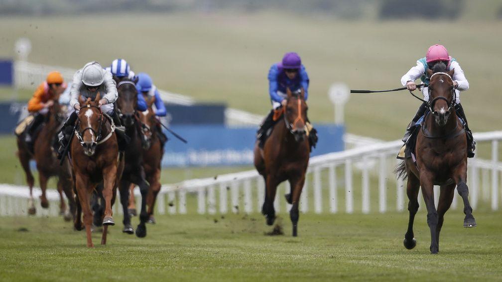 Calyx (right) makes a winning debut at Newmarket