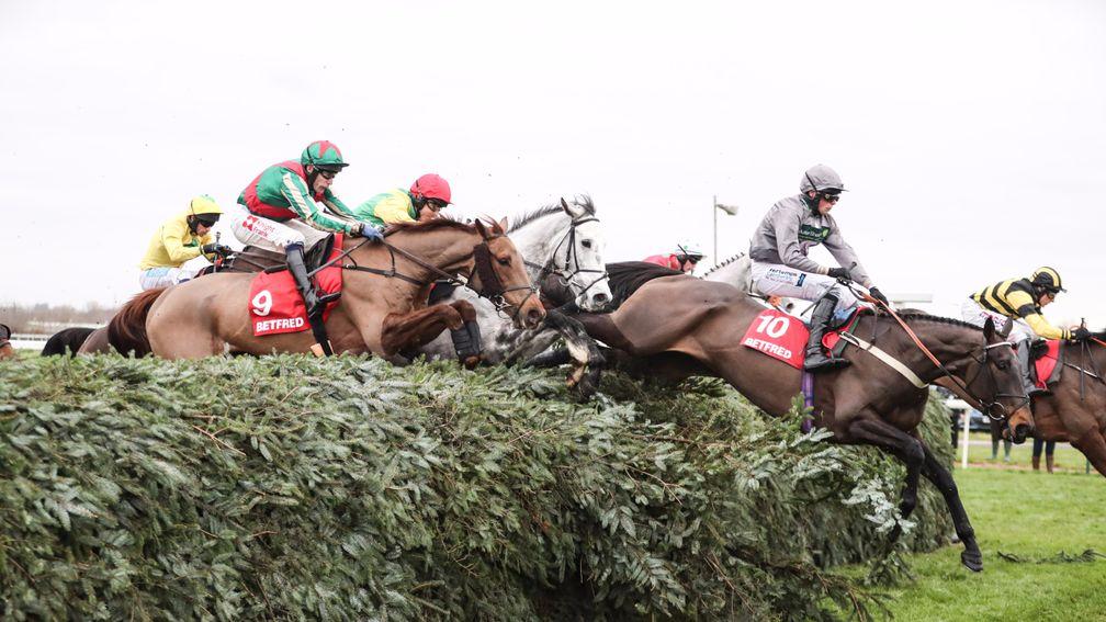 Vieux Lion Rouge (nearest) lands the Becher Chase over the Grand National fences