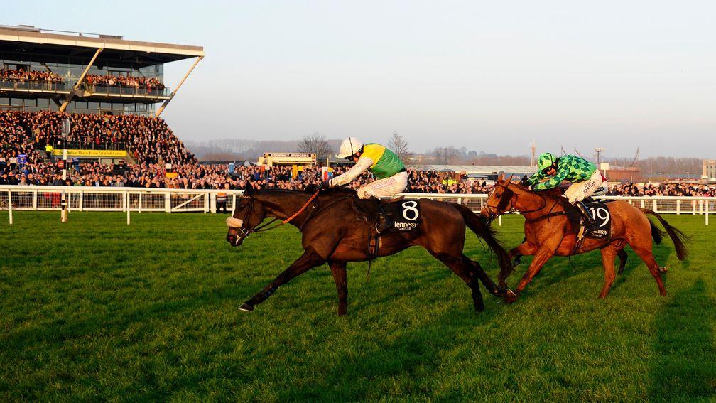 Many Clouds (left) is out in front on the run-in to the 2014 Hennessy Gold Cup at Newbury