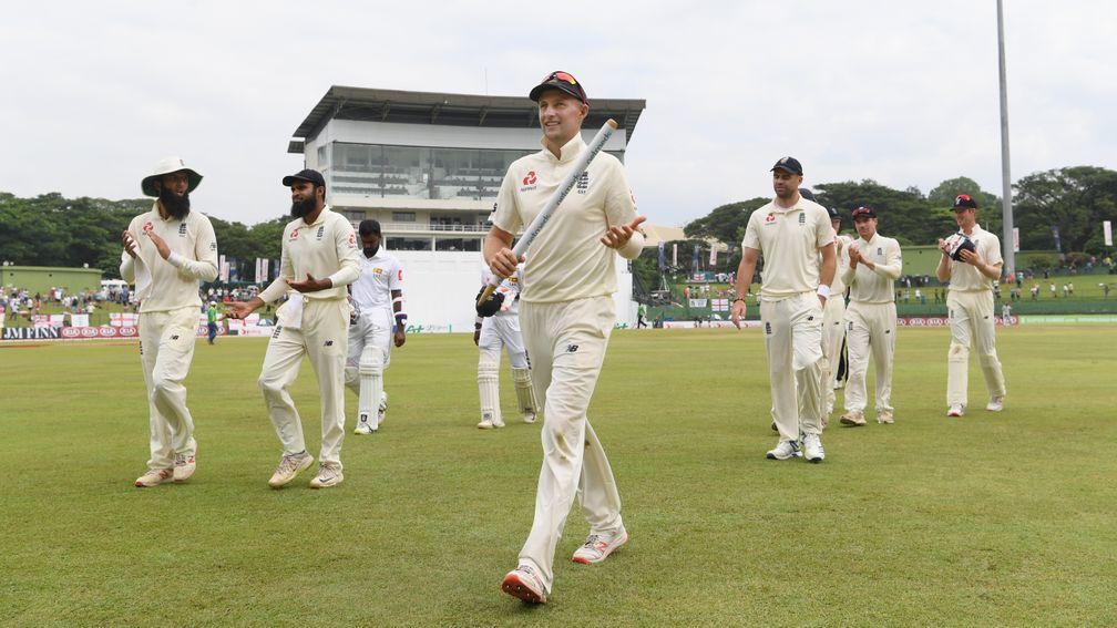 Joe Root leads England off the field after completing a 57-run win in Pallekele