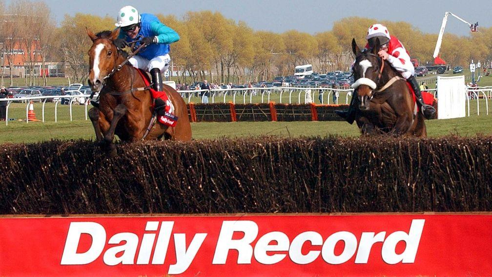 Ryalux (right): jumps the last almost upsides Stormez in the Scottish National in 2003