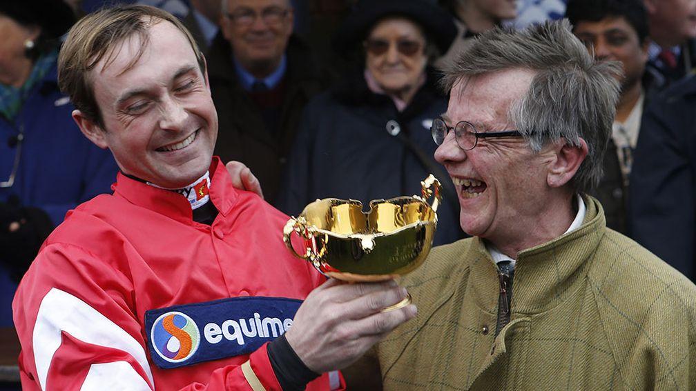 Nico de Boinville and winning trainer Mark Bradstock with the trophy