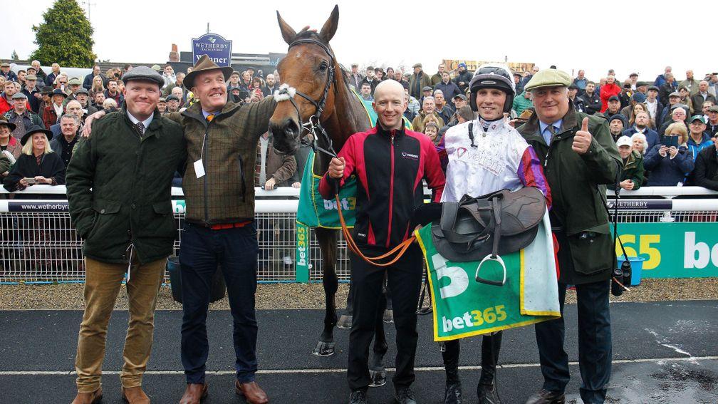 Bravemansgame with owner Bryan Drew (second from left) after victory in the Charlie Hall Chase at Wetherby 
