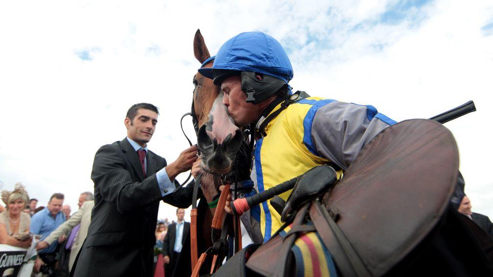 Graham Lee gives Overturn a kiss after his galiant victory in the Galway Hurdle Galway Festival Day Four Photo: Patrick McCann 29.07.2010