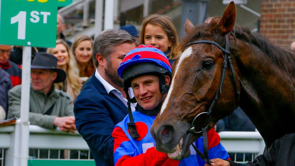 Jamie Moore in the winner's circle with the victorious Step Back