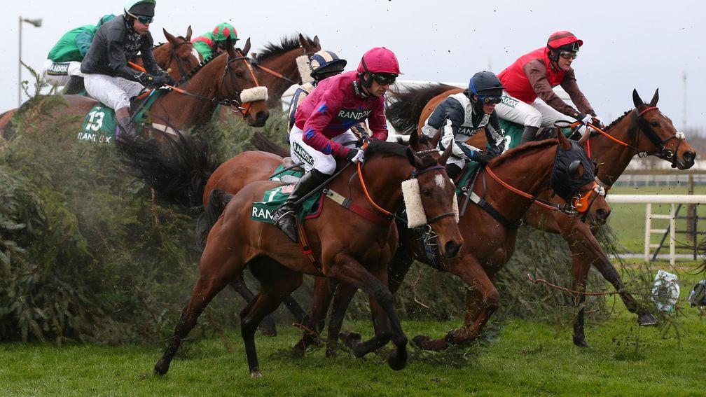 Spruce everywhere: runners in the Foxhunters' brush aside the topping on the National fences