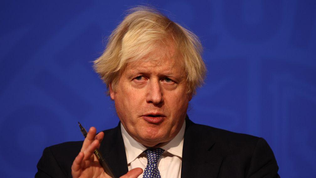 British prime minister Boris Johnson announces the move to Plan B at a Downing Street press conference on Wednesday