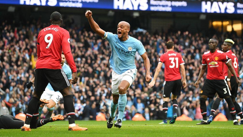 Vincent Kompany celebrates City's first goal against Manchester United at the Etihad Stadium