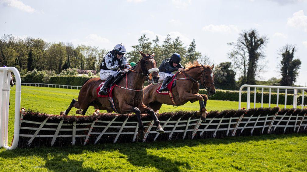 Full Noise and Sean Flanagan (right), jump to the front at the final flight at Punchestown on Sunday