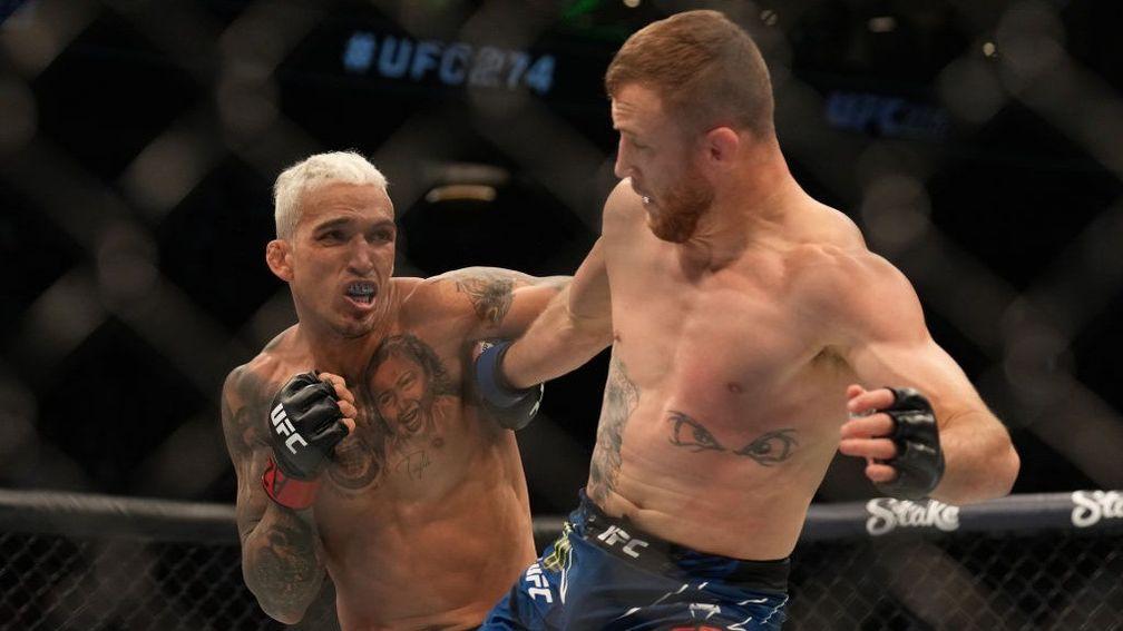 Charles Oliveira (L) defeated Justin Gaethje in his last visit to the Octagon