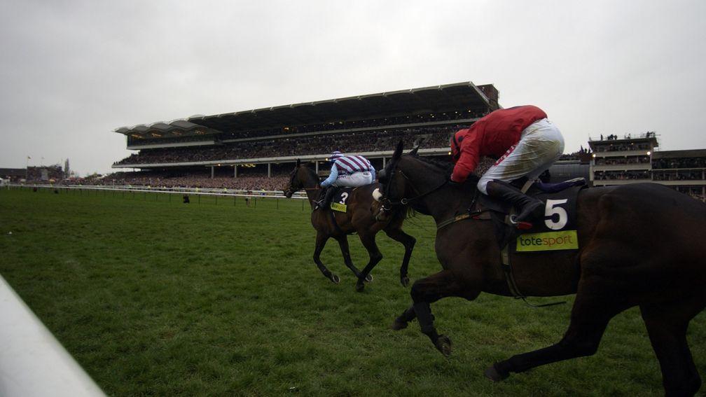 Best Mate powers up the hill to win the Gold Cup for a third time at Cheltenham 18th March 2004 Mirrorpix