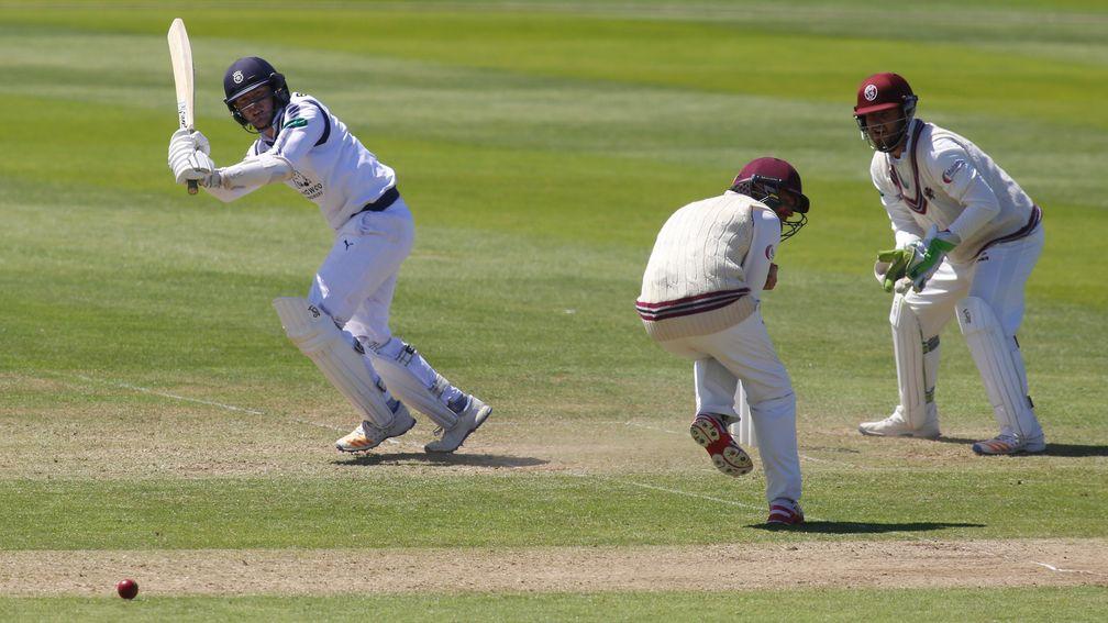 Liam Dawson of Hampshire hits out in their County Championship match against Somerset last month