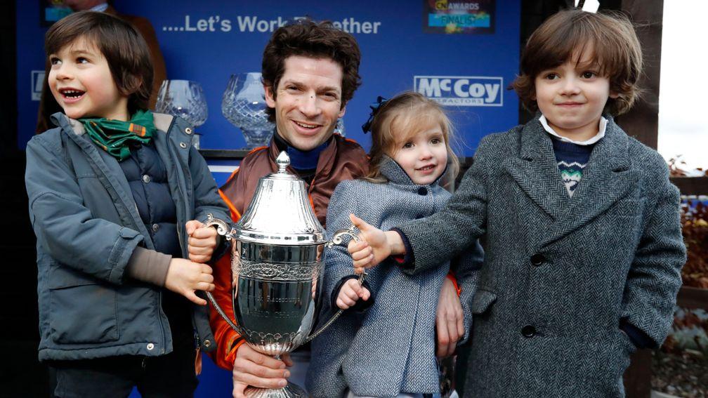 Sam Waley-Cohen with his children Max and Charlotte and nephew Robert (left) after winning the Classic Chase with Impulsive Star