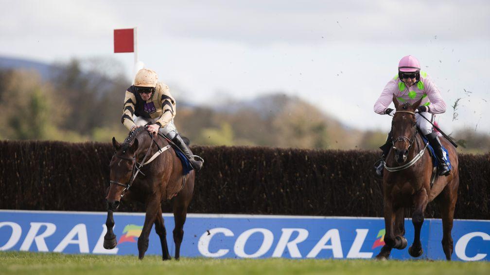 Over the last: Bellshill (left) clears the nal fence under David Mullins on the way to victory over Djakadam in the Coral Punchestown Gold Cup