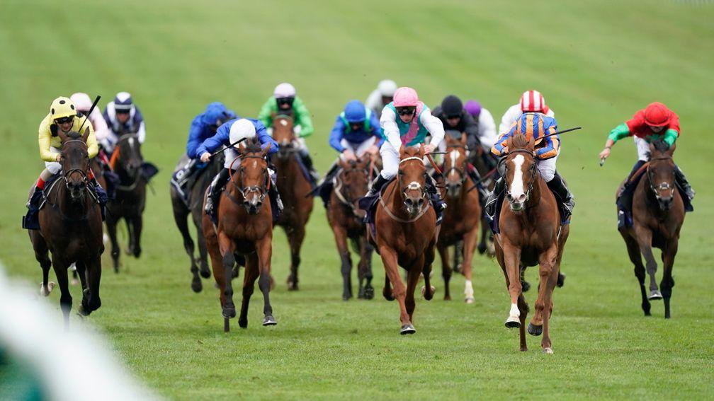 NEWMARKET, ENGLAND - JUNE 07: Ryan Moore riding Love (R, blue/orange) win The Qipco 1000 Guineas Stakes at Newmarket Racecourse on June 07, 2020 in Newmarket, England. (Photo by Alan Crowhurst/Getty Images)