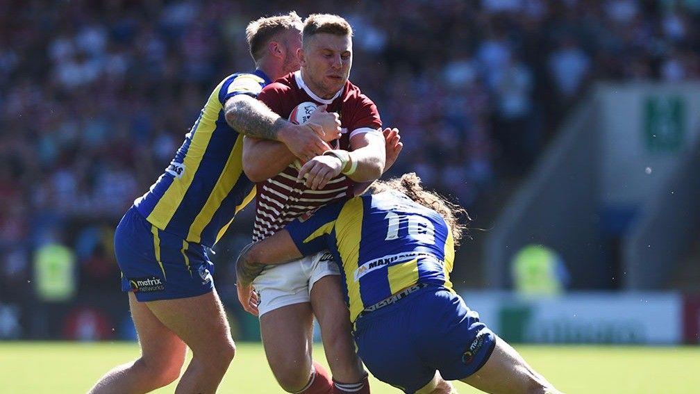 George Williams on the charge for Wigan against Warrington