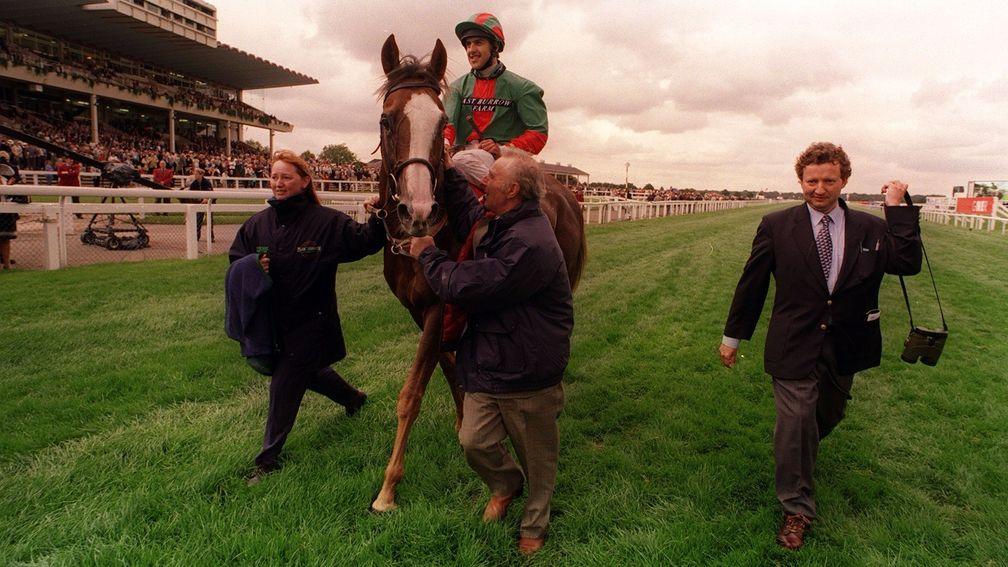 Double Trigger and Darryll Holland are led in after landing the 1998 Doncaster Cup