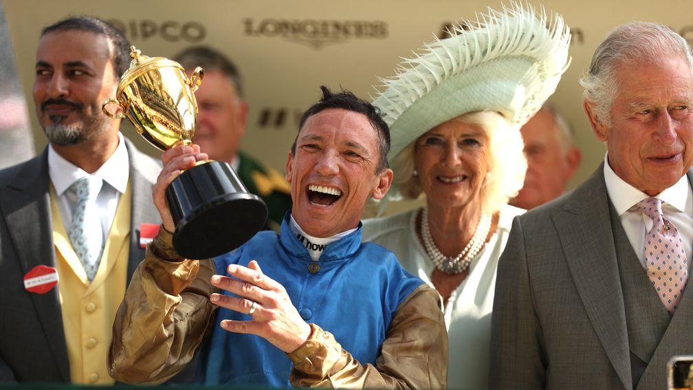 Frankie Dettori lifts the Gold Cup alongside the Queen and King