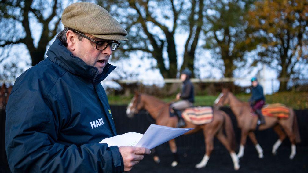 Trainer Alan King issues instructions to 1st lot  as they warm up in the school at Barbury Castle  near Marlborough in Wiltshire 7.11.19 Pic: Edward Whitaker