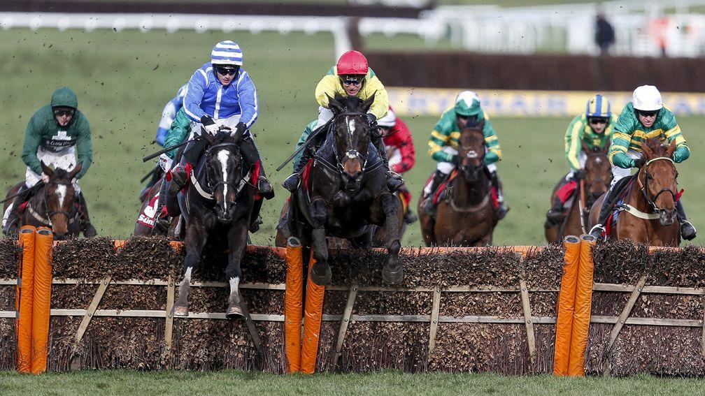Penhill (left) just leads the Supasundae over the final flight in the Stayers’ Hurdle