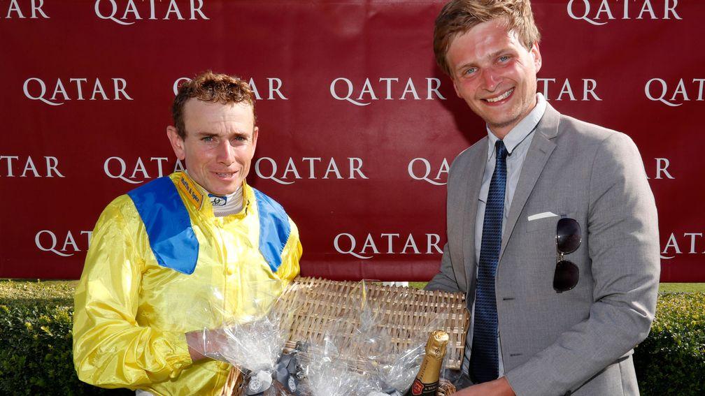Racing UK’s Anthony Dunkley presents Ryan Moore with his prize