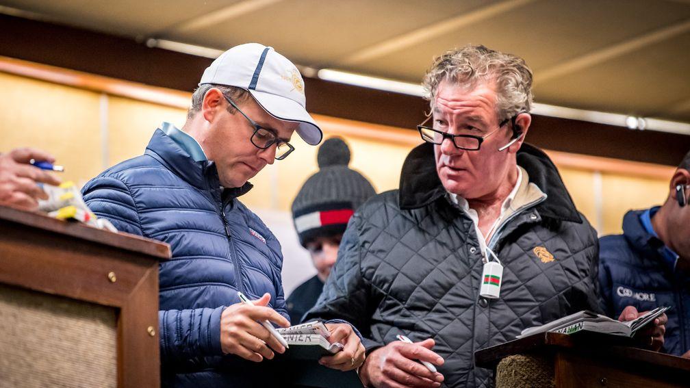 MV Magnier (left) with Paul Shanahan examines the page of the €700,000 No Nay Never filly