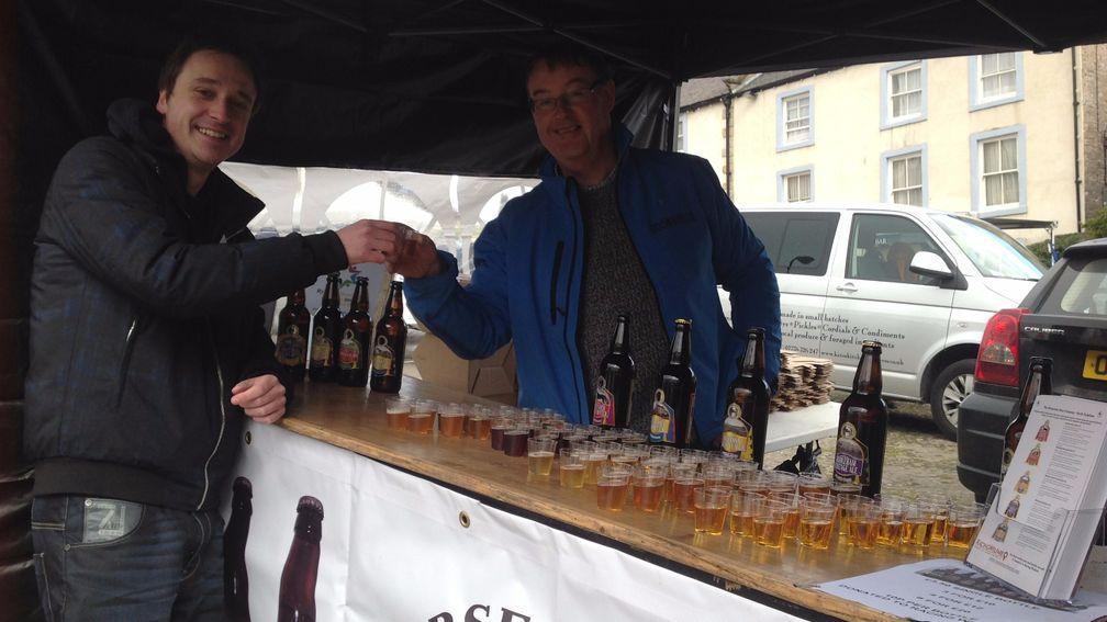 Howard Kinder (right), founder of the Horsetown Beer Company, offers Radio Yorkshire's Bobby Beevers a drink at the Middleham Open Day