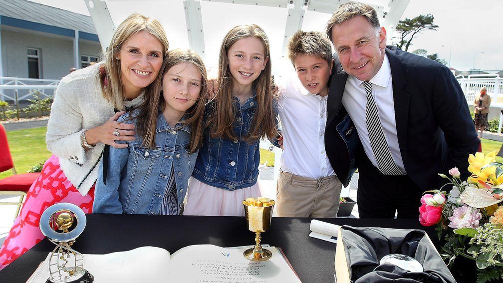 Henry de Bromhead with wife Heather and children Georgia, Mia and Jack after he was conferred with the Freedom of Waterford City and County. In the foreground are the Grand National and Gold Cup trophies, sitting on his scroll