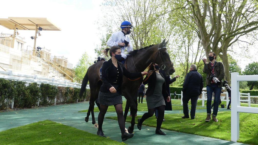Coeursamba and Cristian Demuro return to the Longchamp winner's enclosure after winning The Emirates Poule d'Essai des Pouliches