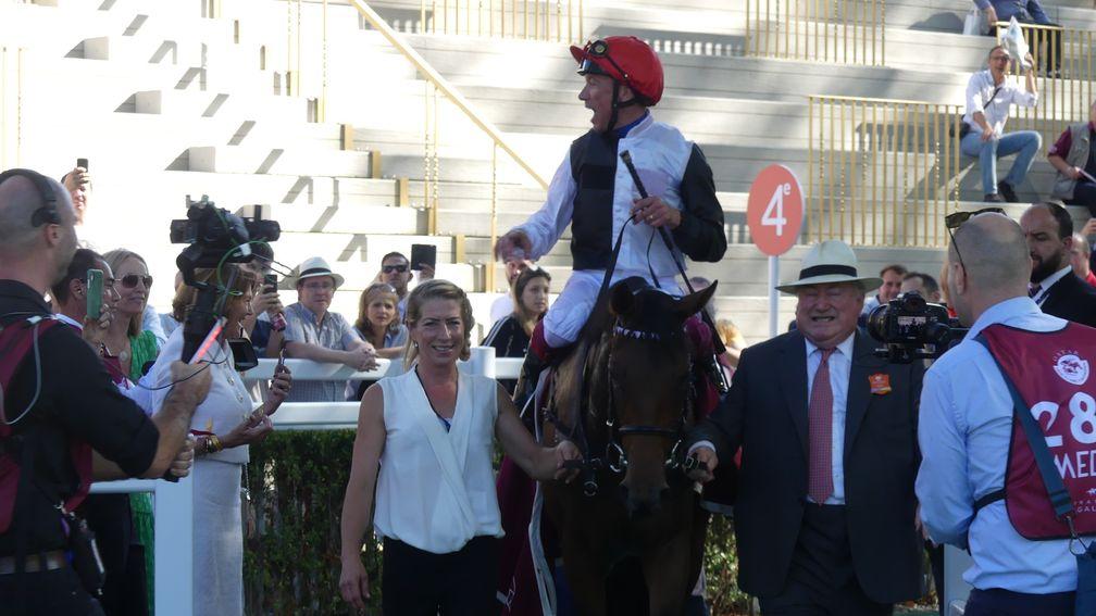 Frankie Dettori receives the applause of the Longchamp crowd after Star Catcher wins the Prix Vermeille for owner-breeder Anthony Oppenheimer (right)