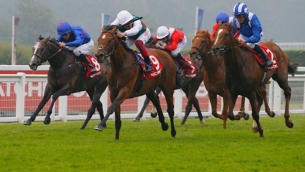 Without Parole and Frankie Dettori (centre) hold off Gabr (right) to land the Heron Stakes