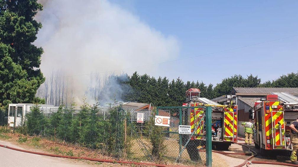 Fire engines deal with the fire at the National Horseracing College on Tuesday afternoon