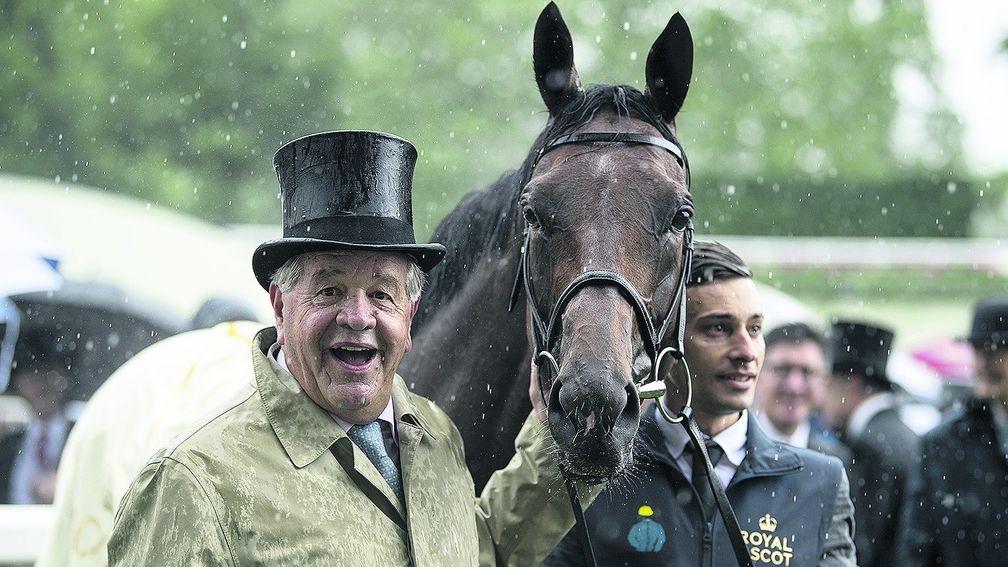 Smiling in the rain: Sir Michael Stoute's enthusiasm was undampened by the weather after Crystal Ocean's Prince of Wales's Stakes success