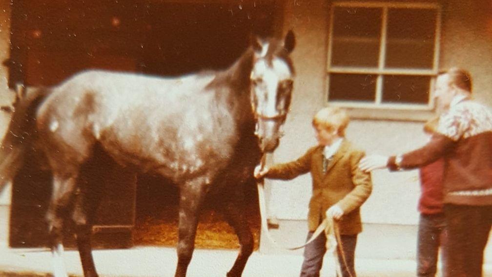 A young Gerry Meehan is shown the ropes of showing horses by his father