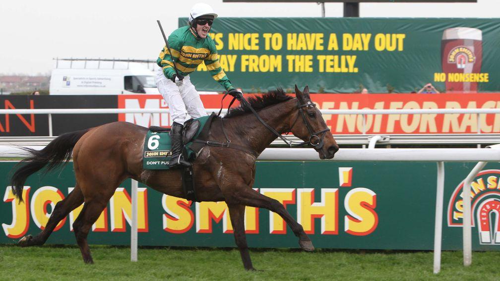 McCoy celebrates as he reaches the finish with five lengths to spare